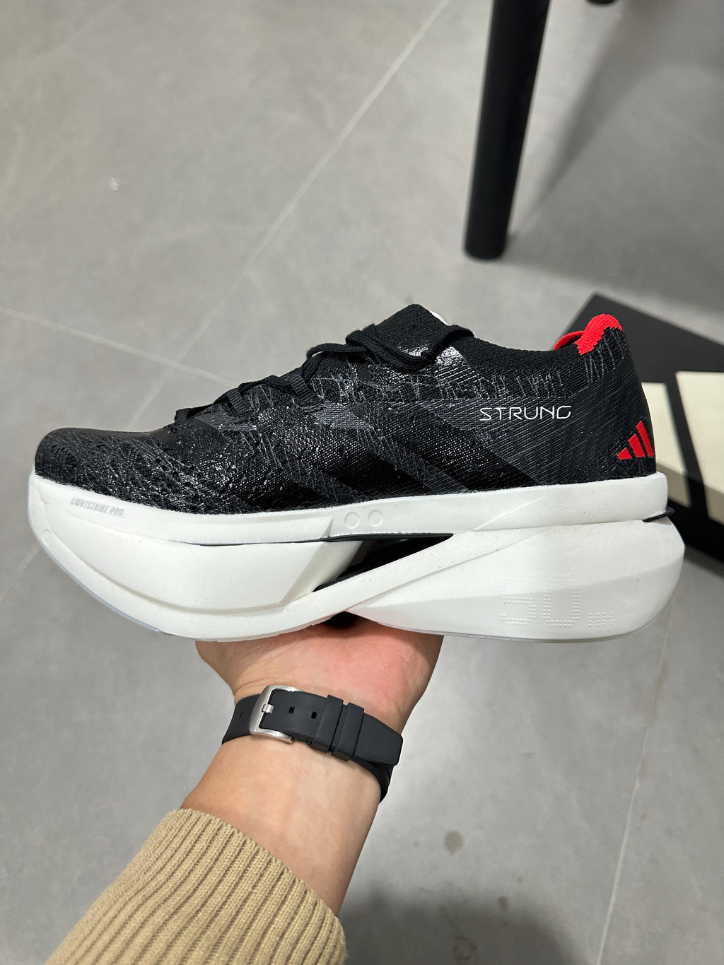 Adidas ADIZERO ADIOS PRO 4 (Core Black / Cloud White / Solar Red colorway)