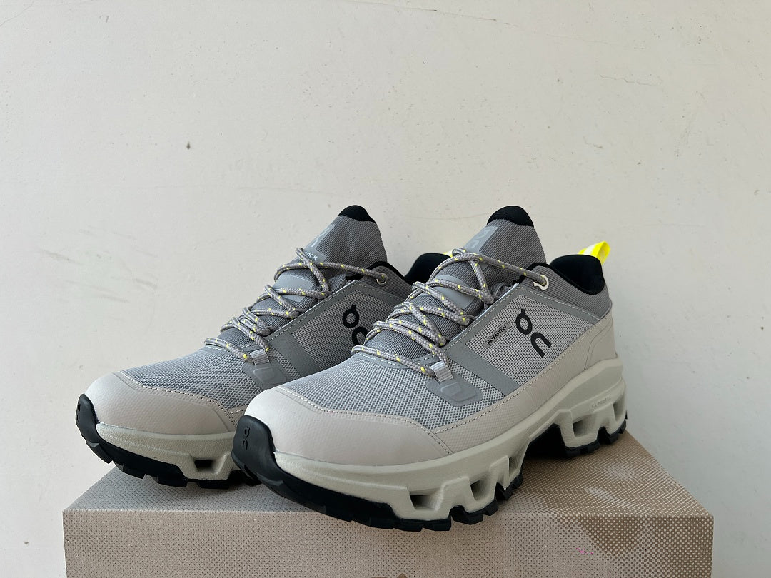 On Cloudrock Low Waterproof Hiking Shoes in Grey / Sand with Yellow Accents