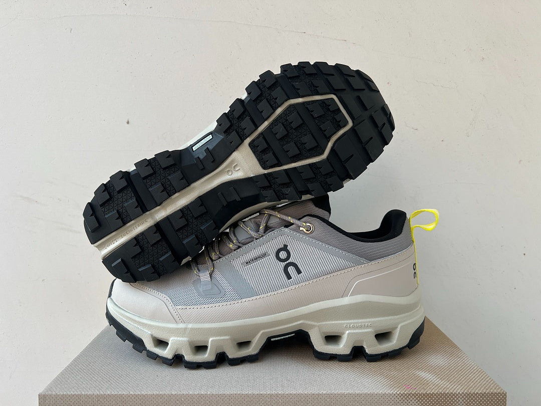 On Cloudrock Low Waterproof Hiking Shoes in Grey / Sand with Yellow Accents
