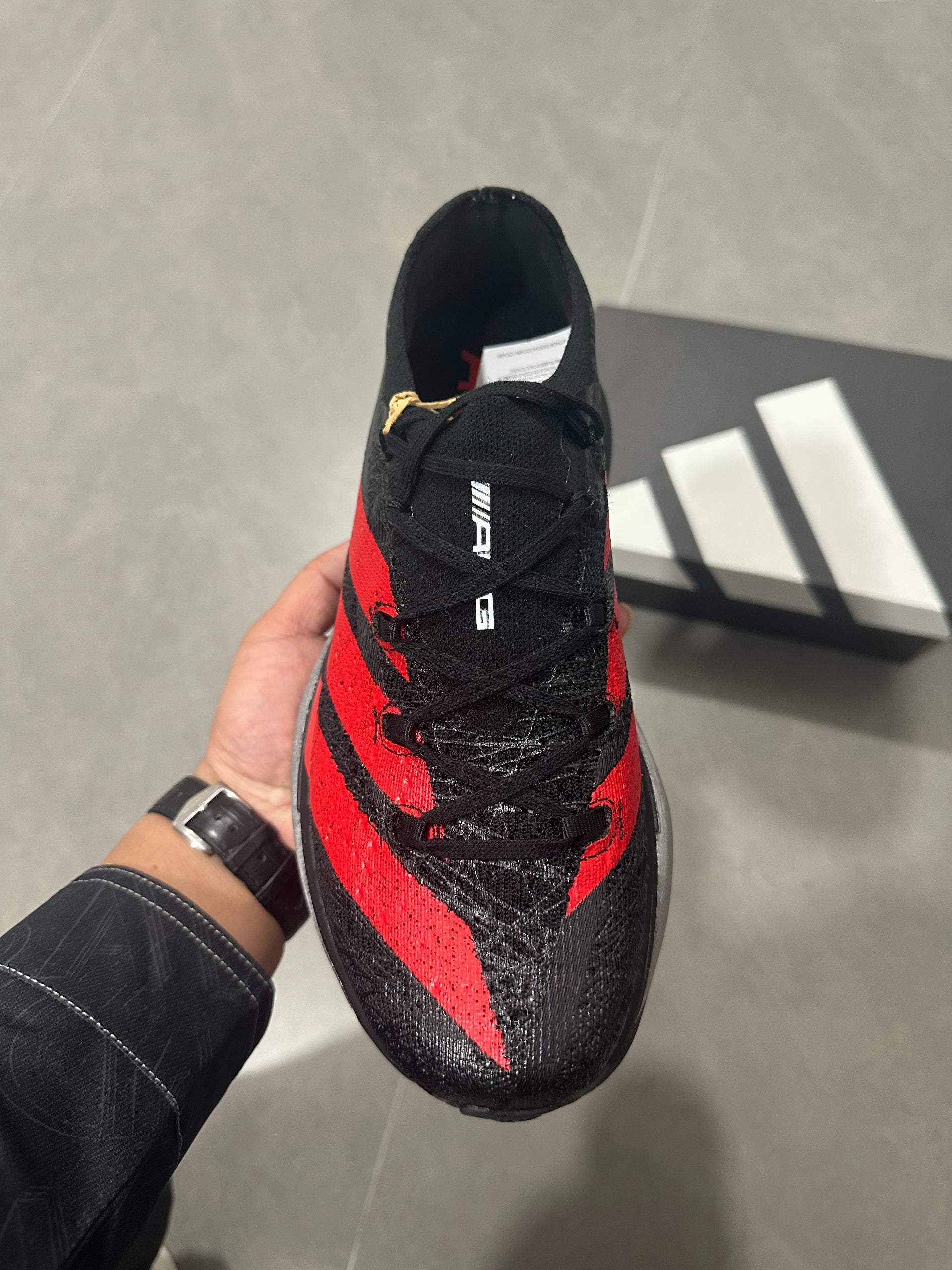 Adidas ADIZERO ADIOS PRO 4 (Core Black / Red / Silver colorway)