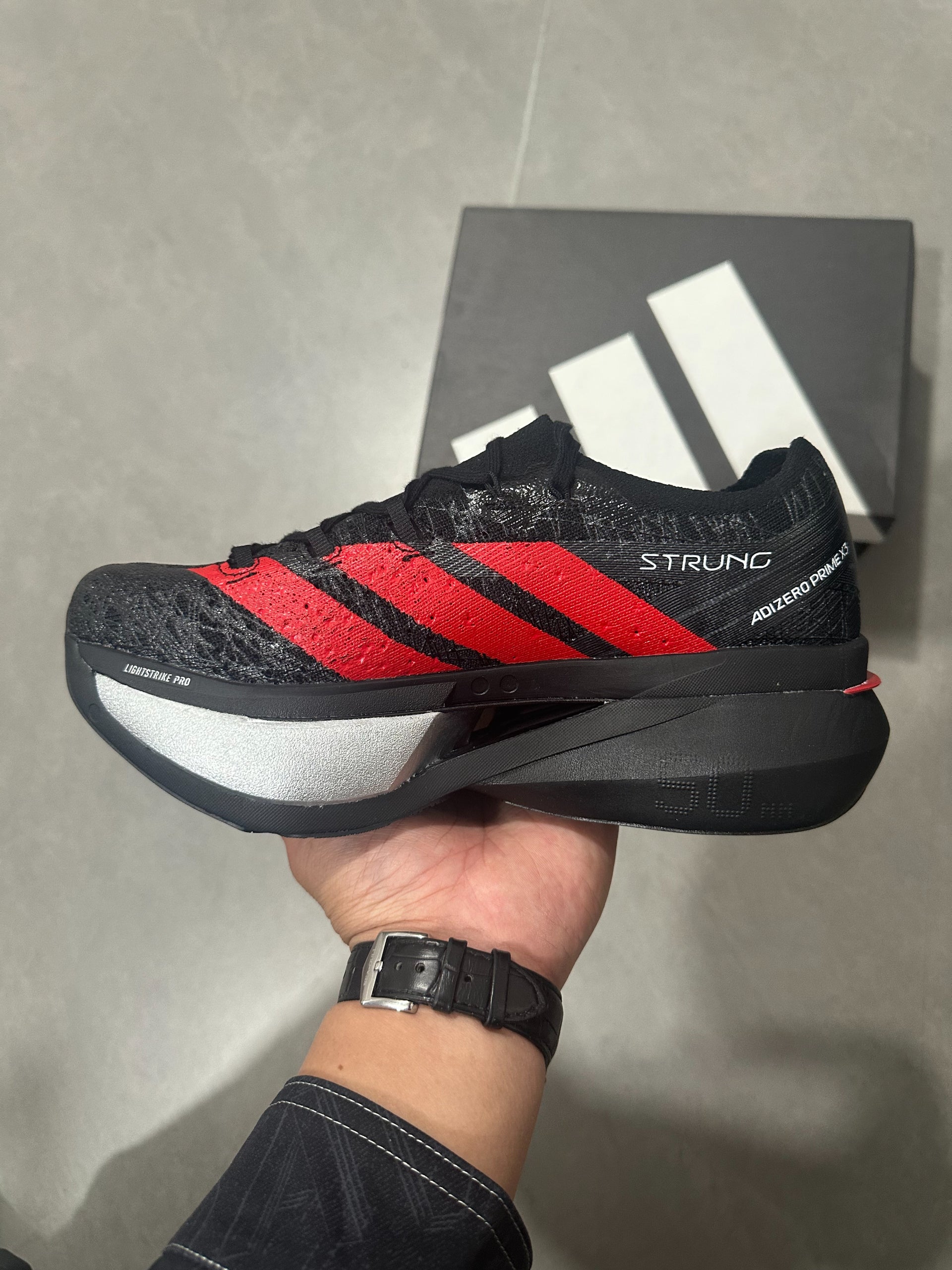 Adidas ADIZERO ADIOS PRO 4 (Core Black / Red / Silver colorway)