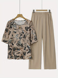 A Set Consisting of Two Women'S Floral Print Tops And Straight Casual Pants, Featuring an Elegant Round-Neck Short-Sleeve Top Paired with Solid Color Long Pants